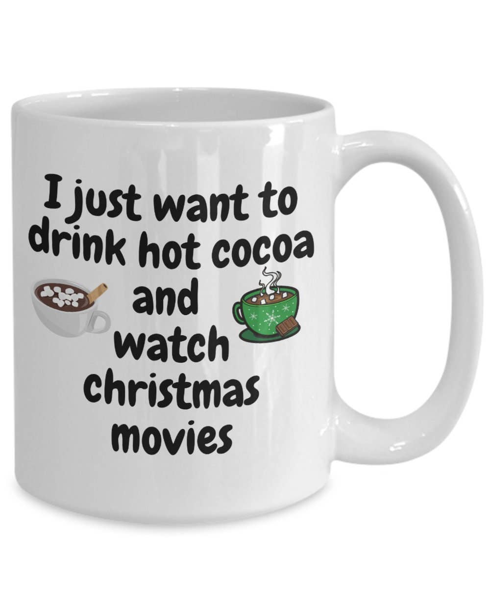 White mug with text 'I just want to drink hot cocoa and watch Christmas movies' and illustrations of hot cocoa and a movie screen.