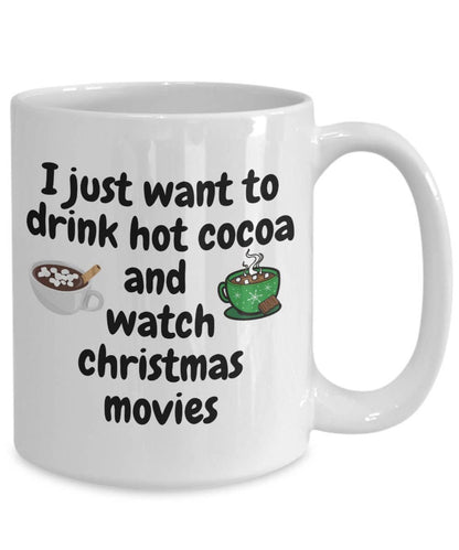 White mug with text 'I just want to drink hot cocoa and watch Christmas movies' and illustrations of hot cocoa and a movie screen.