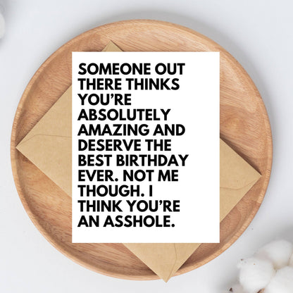 Card with humorous birthday message on a wooden plate