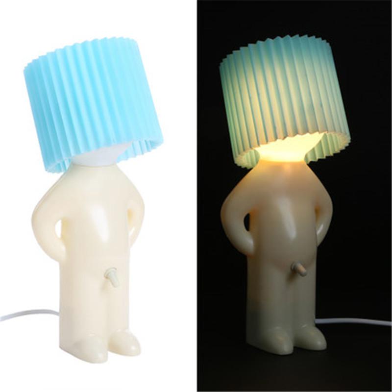 Shy little boy reading lamp