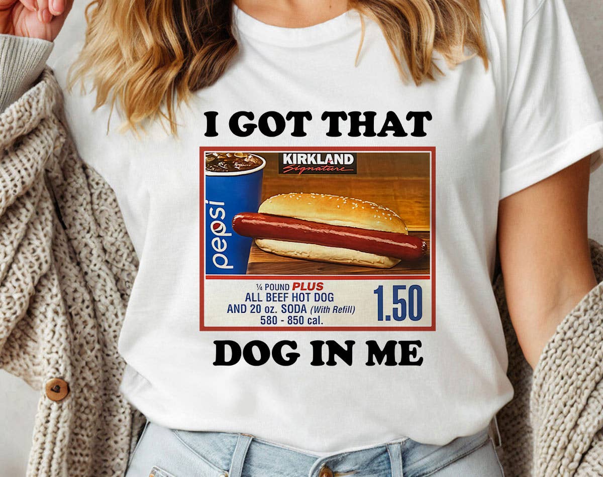 Person wearing a white t-shirt with a humorous graphic and text.