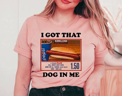 Person wearing a pink t-shirt with a graphic design and text.