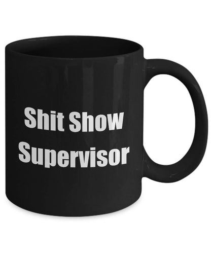 Black mug with 'Shit Show Supervisor' text on a white background