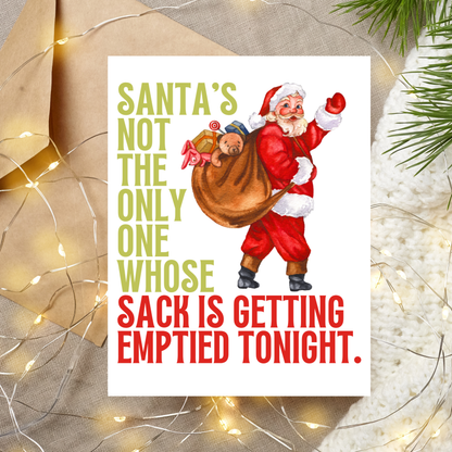 Christmas card with Santa Claus and humorous text on a decorative background with lights and greenery.
