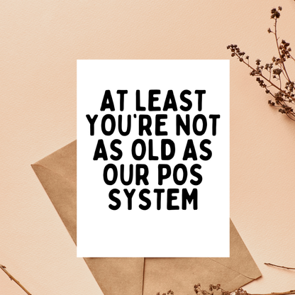 Card with humorous text on a beige background with an envelope and branches.