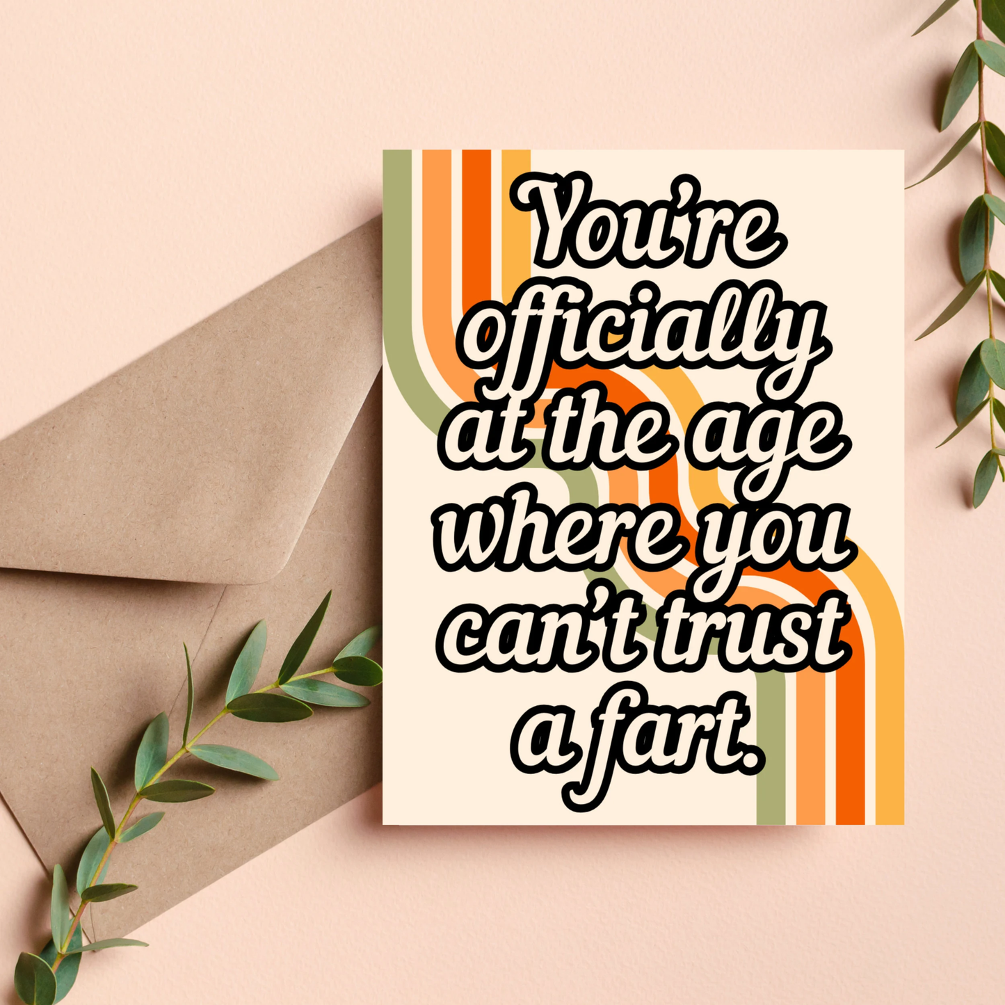 Card with humorous text on a beige background with an envelope and leaves.