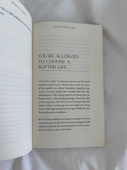 Open book with a quote on a white background